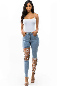 Thumbnail for Crisscross Strap Denim Cut Skinny Jeans