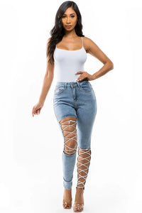 Thumbnail for Crisscross Strap Denim Cut Skinny Jeans